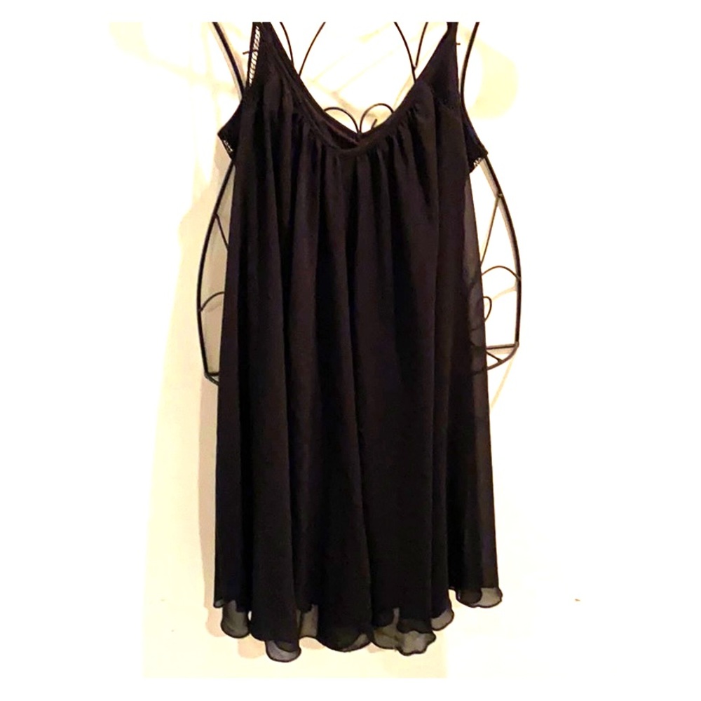 Black dress with sheer top layer.